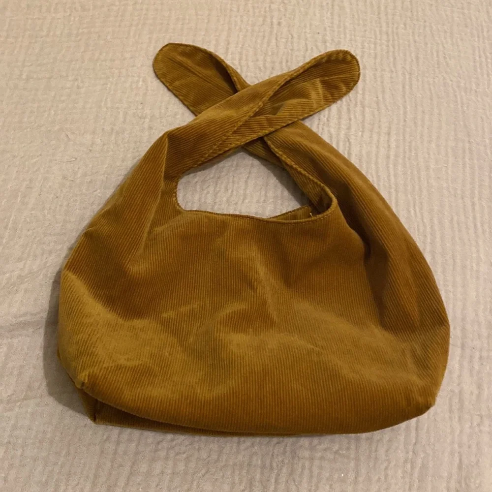 MERIT Elegant Tan Knot Cosmetics Bag